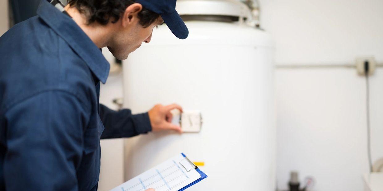 Man checking water heater.